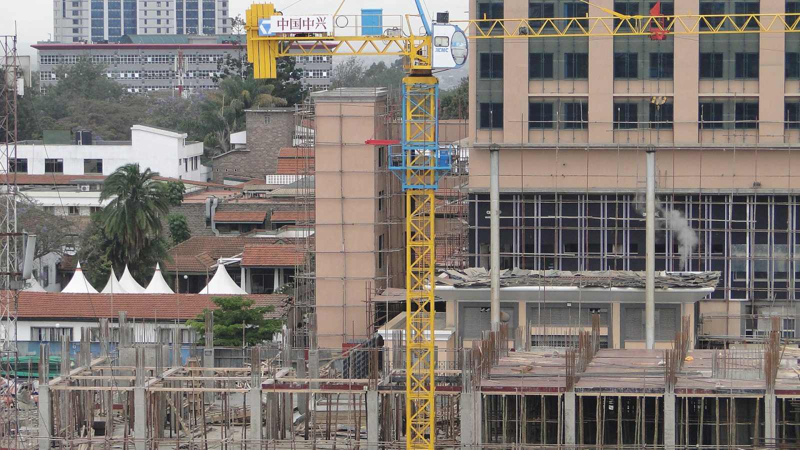 Multi-story building under construction with scaffolding in Nairobi, Kenya.